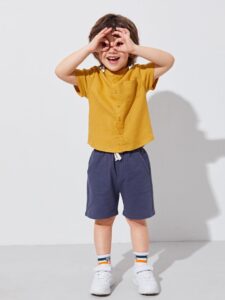 "Kids wearing eco-friendly outfits", "Summer fashion for children 2025", "Boys and girls in organic cotton clothing"
